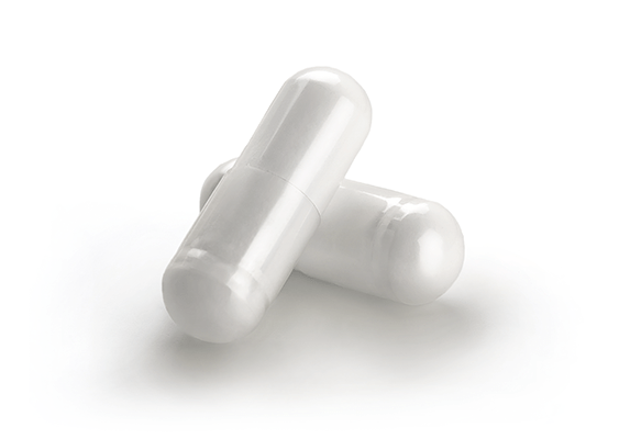 Capsules of DHEA on a white background